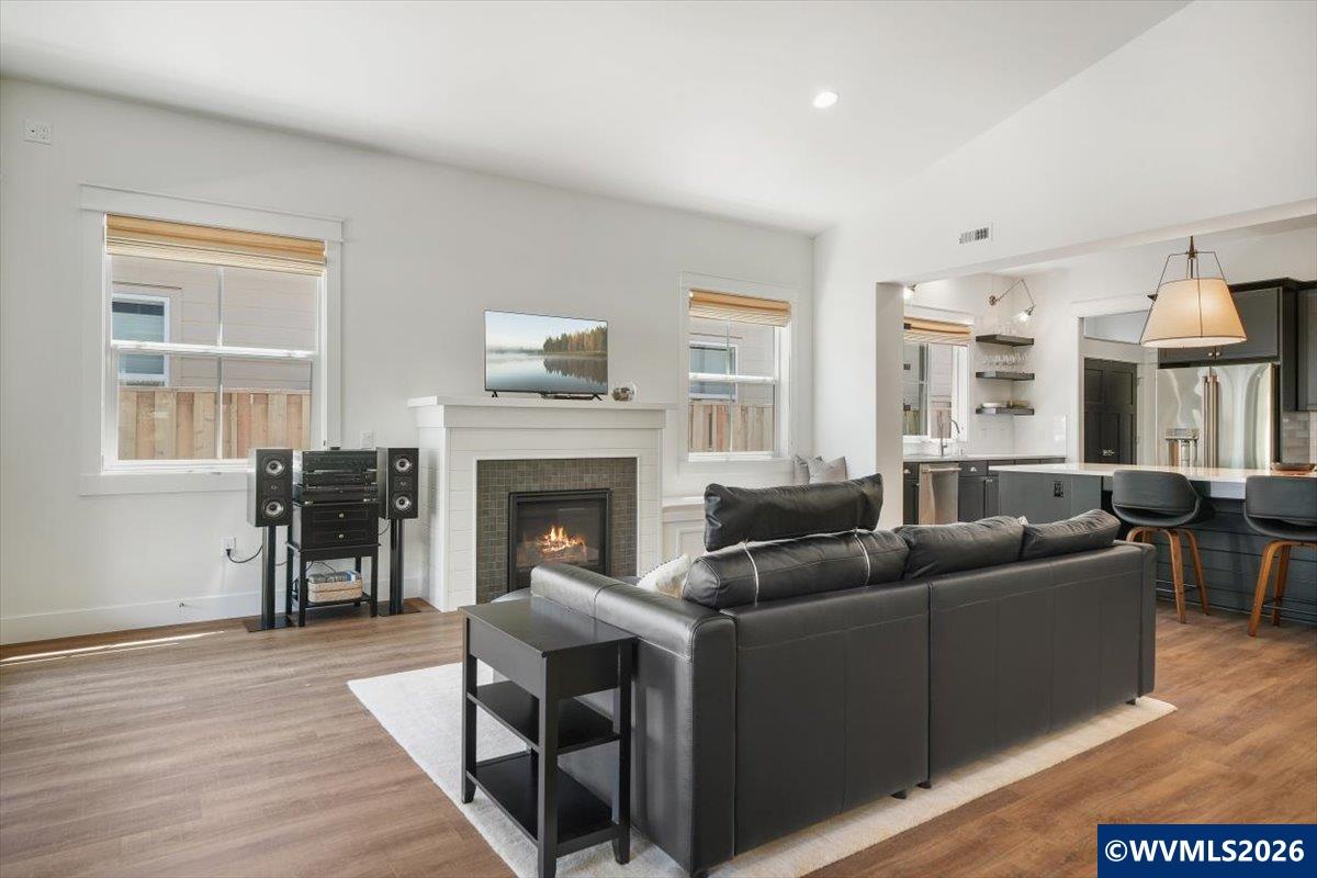 1115 Southwest Sylvia Street Corvallis, OR 97333 - Photo 7 of 22 a living room with furniture and a fireplace