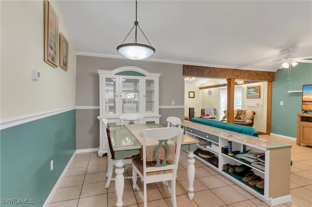 a large kitchen with a table and chairs