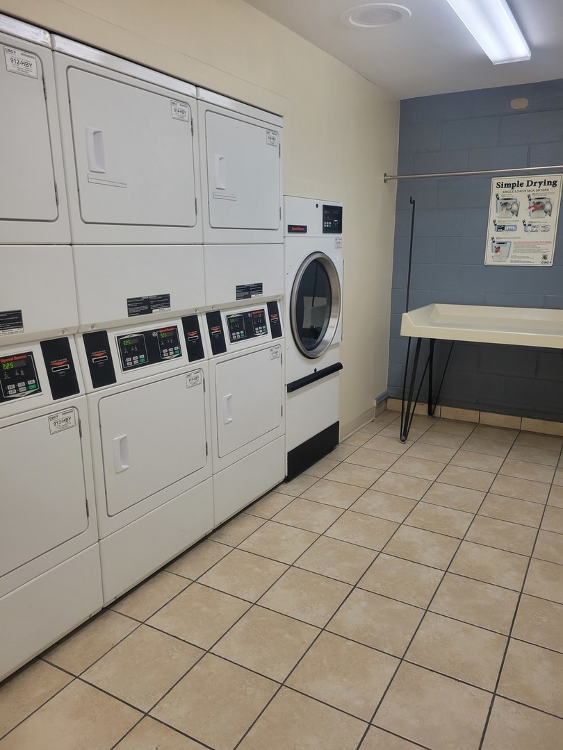 111 East Chestnut Street, Unit 20D Chicago, IL 60611 - Photo 8 of 8 a utility room with dryer and washer