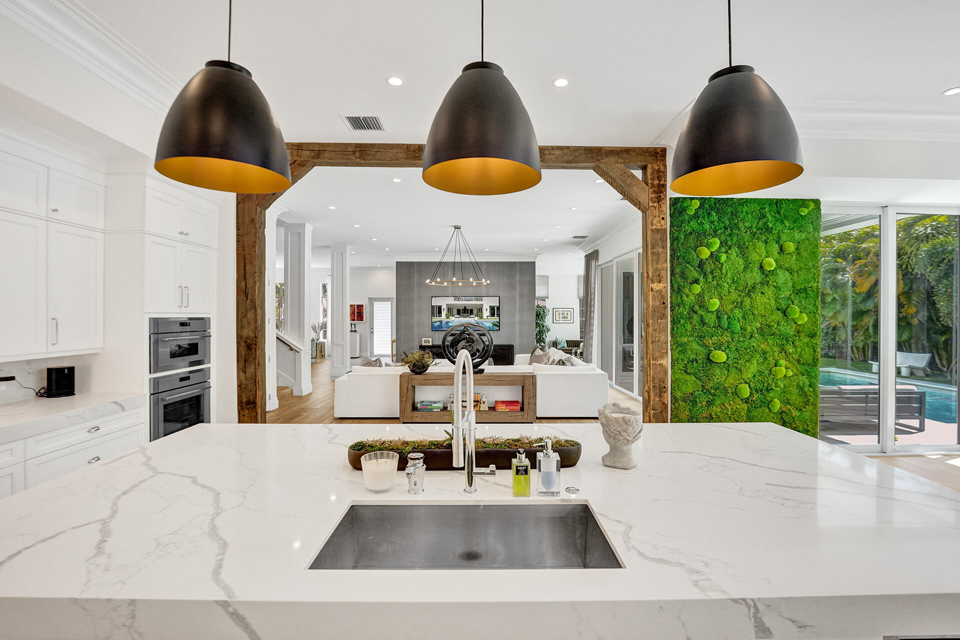 700 Northwest 6th Street Boca Raton, FL 33486 - Photo 14 of 40 a view of a kitchen with dining table and chairs