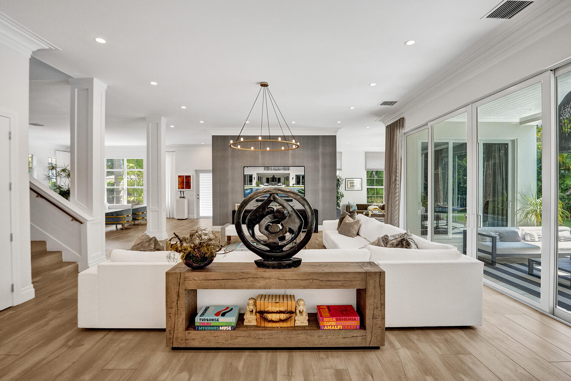 700 Northwest 6th Street Boca Raton, FL 33486 - Photo 18 of 40 a living room with furniture and a chandelier