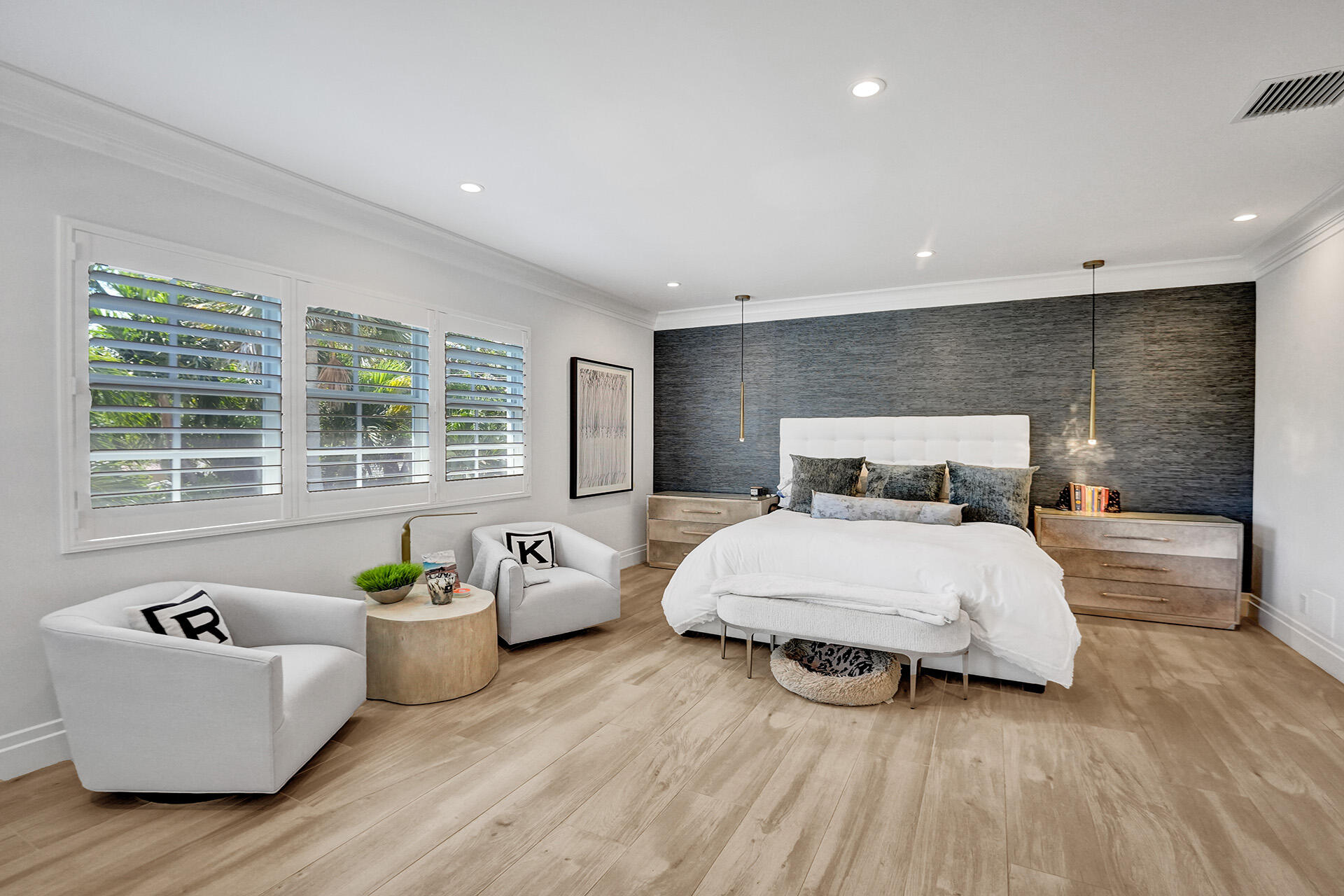 700 Northwest 6th Street Boca Raton, FL 33486 - Photo 21 of 40 a bedroom with a bed and wooden floor