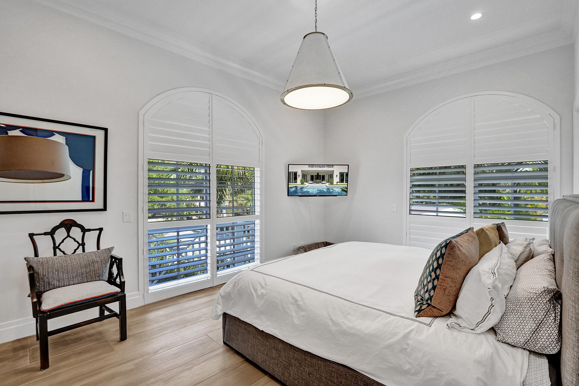 700 Northwest 6th Street Boca Raton, FL 33486 - Photo 25 of 40 a bedroom with a bed and wooden floor