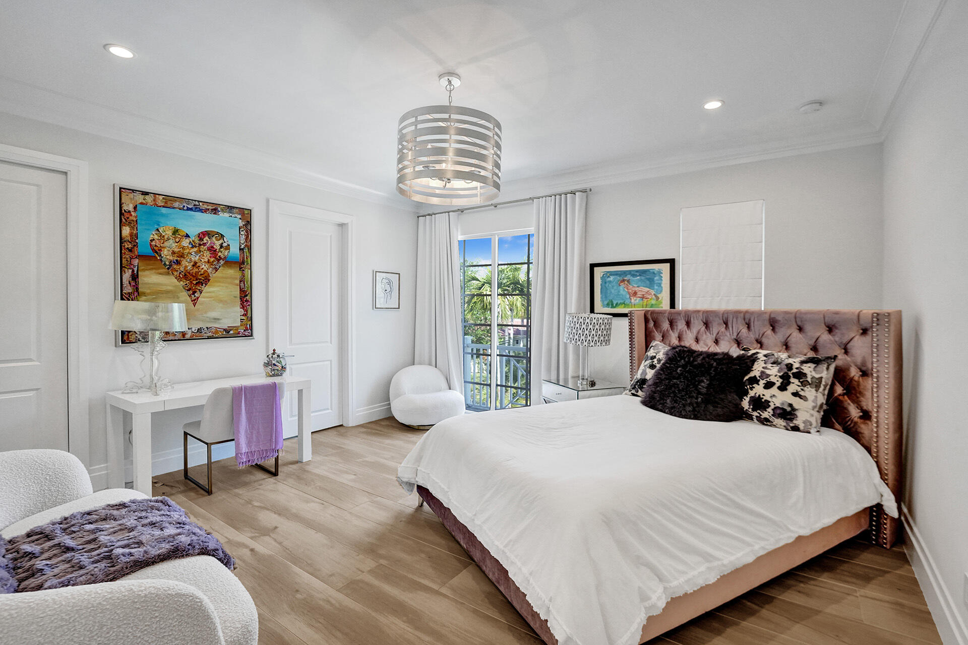 700 Northwest 6th Street Boca Raton, FL 33486 - Photo 27 of 40 a bedroom with a bed and a chandelier