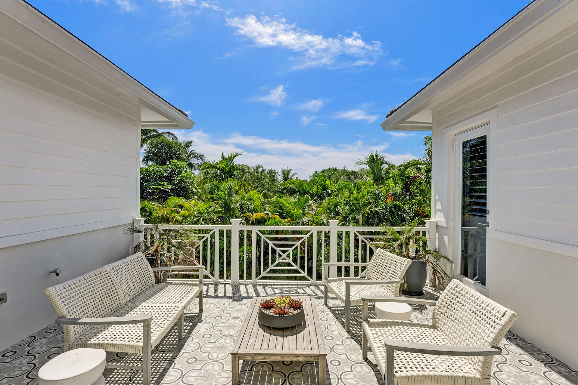 700 Northwest 6th Street Boca Raton, FL 33486 - Photo 31 of 40 a balcony with wooden floor table and chairs