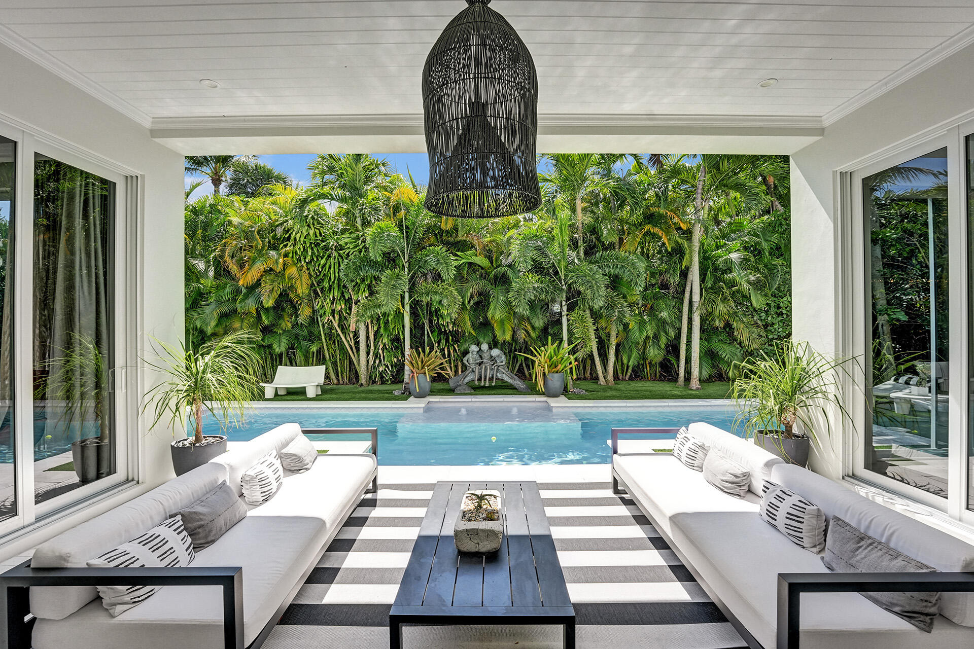 700 Northwest 6th Street Boca Raton, FL 33486 - Photo 33 of 40 a view of a yard with furniture and floor to ceiling window