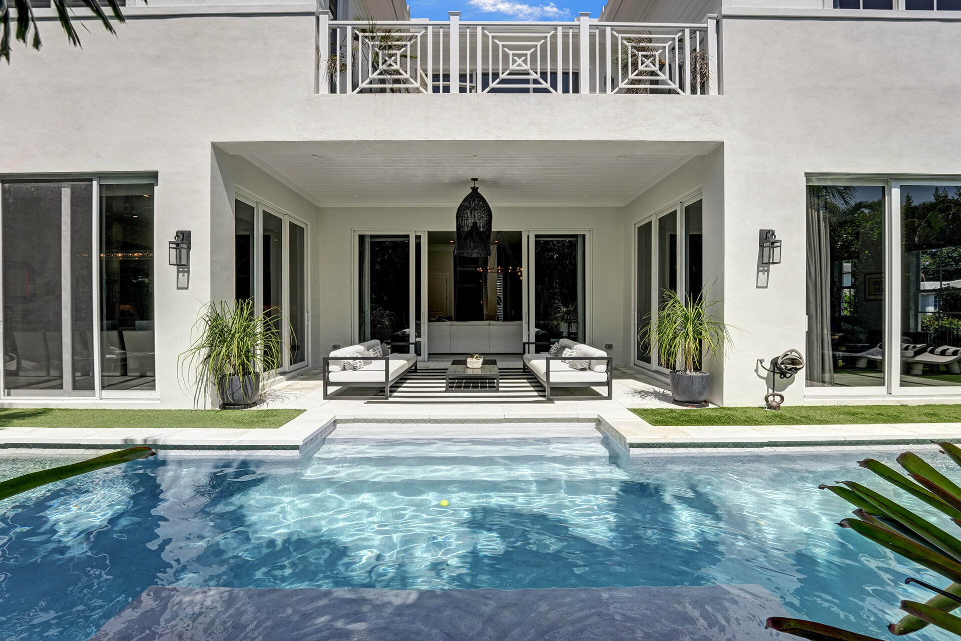 700 Northwest 6th Street Boca Raton, FL 33486 - Photo 34 of 40 a view of a house with backyard porch and furniture