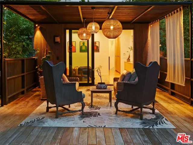 a view of a chairs and table in the patio