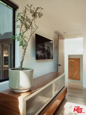 a bathroom with a tub shower and mirror