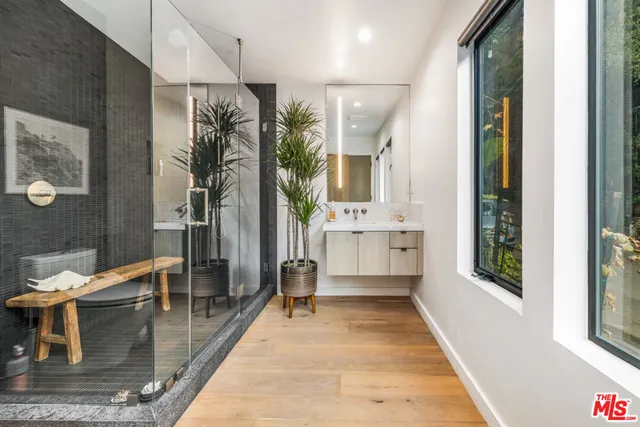 a swimming pool with outdoor seating and yard