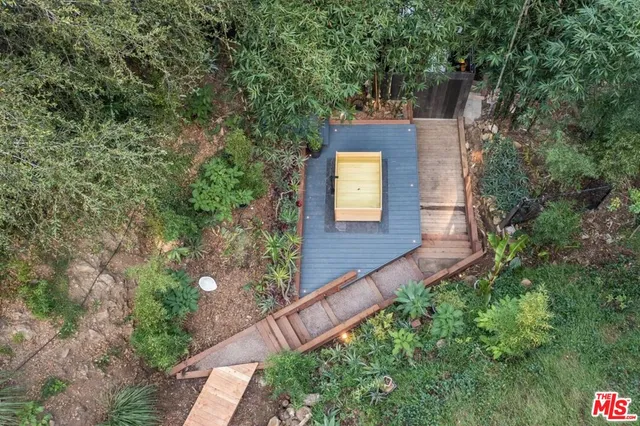 a view of a pathway both side of yard