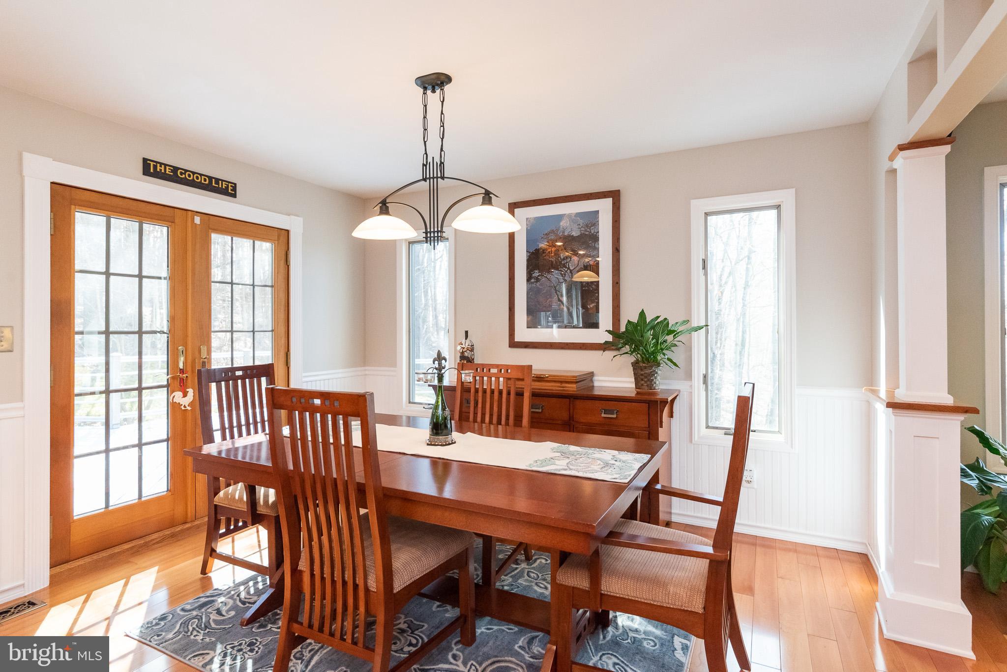 16550 Yeoho Road Sparks, MD 21152 - Photo 12 of 67 a view of a dining room with furniture window and wooden floor