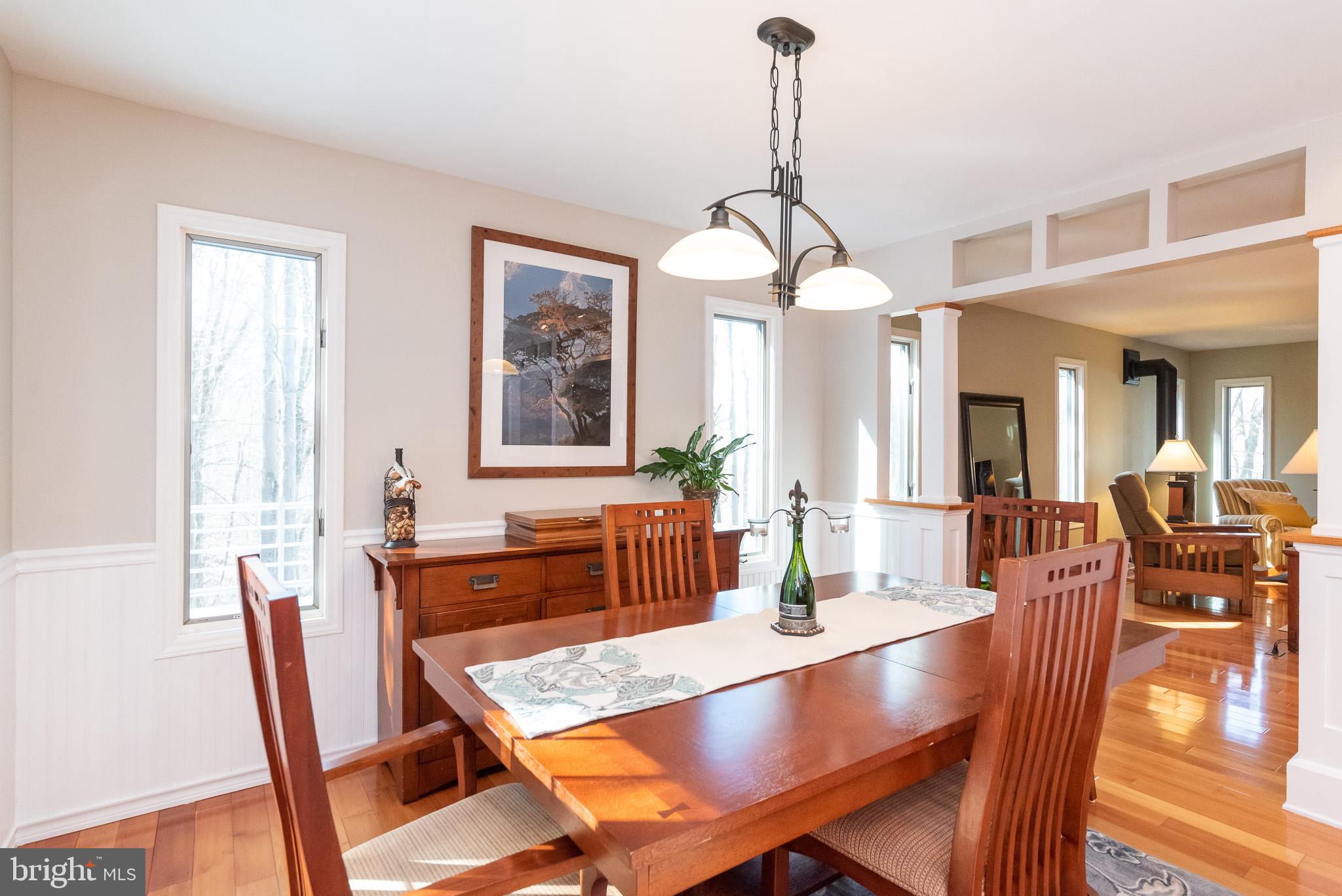 16550 Yeoho Road Sparks, MD 21152 - Photo 13 of 67 a view of a a dining room with furniture window and wooden floor