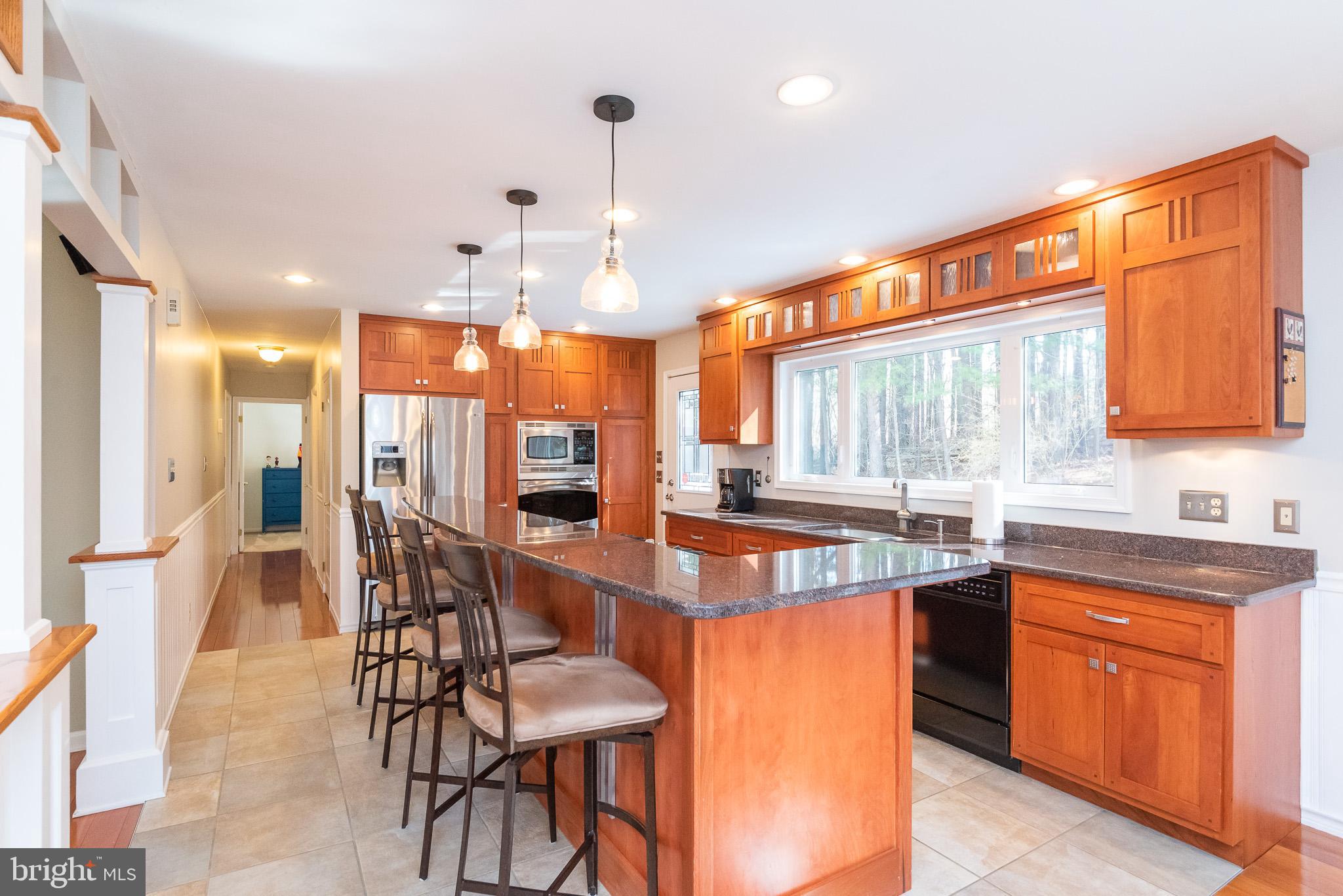 16550 Yeoho Road Sparks, MD 21152 - Photo 15 of 67 a large kitchen with a table and chairs