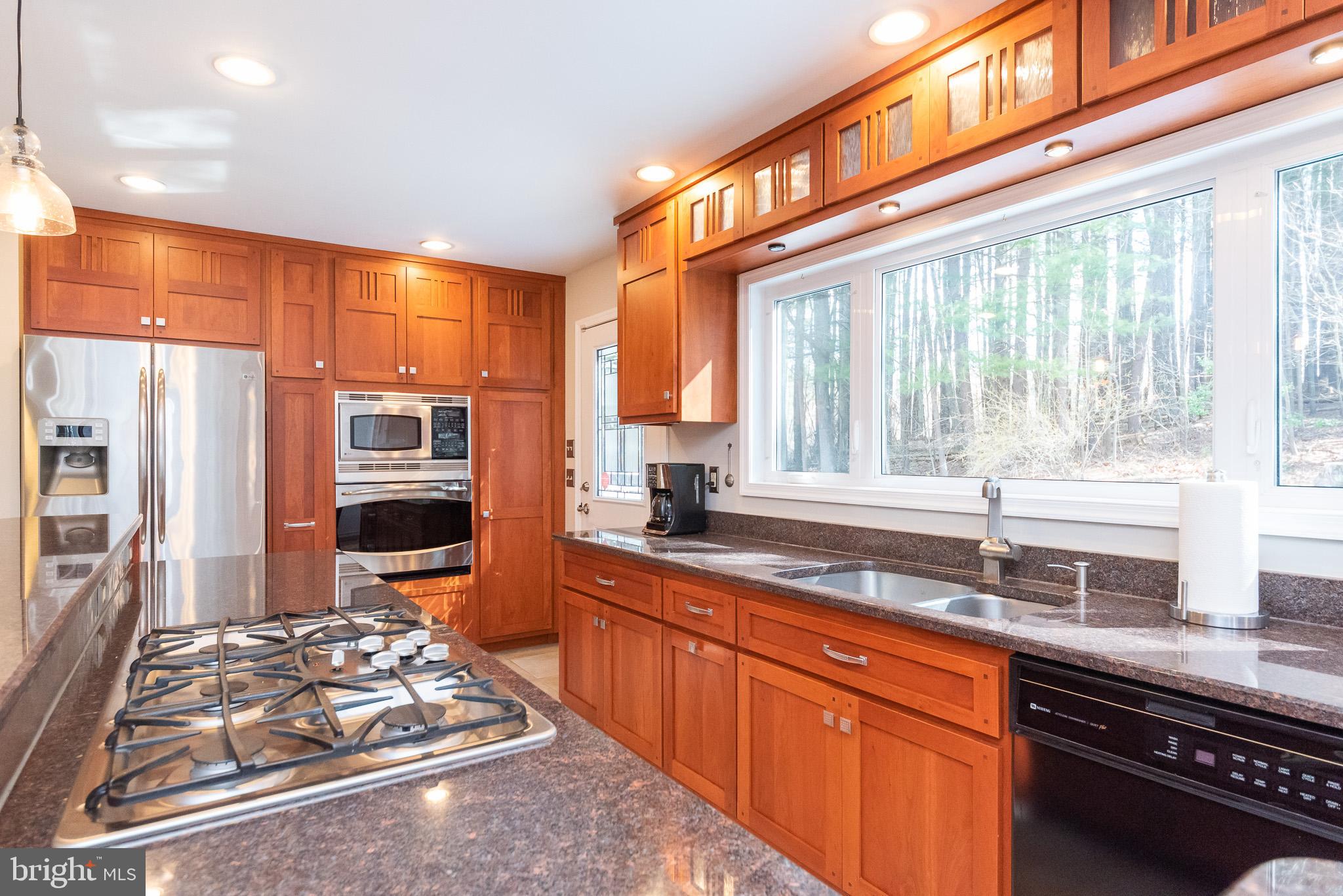 16550 Yeoho Road Sparks, MD 21152 - Photo 16 of 67 a kitchen with stainless steel appliances granite countertop a stove and a sink