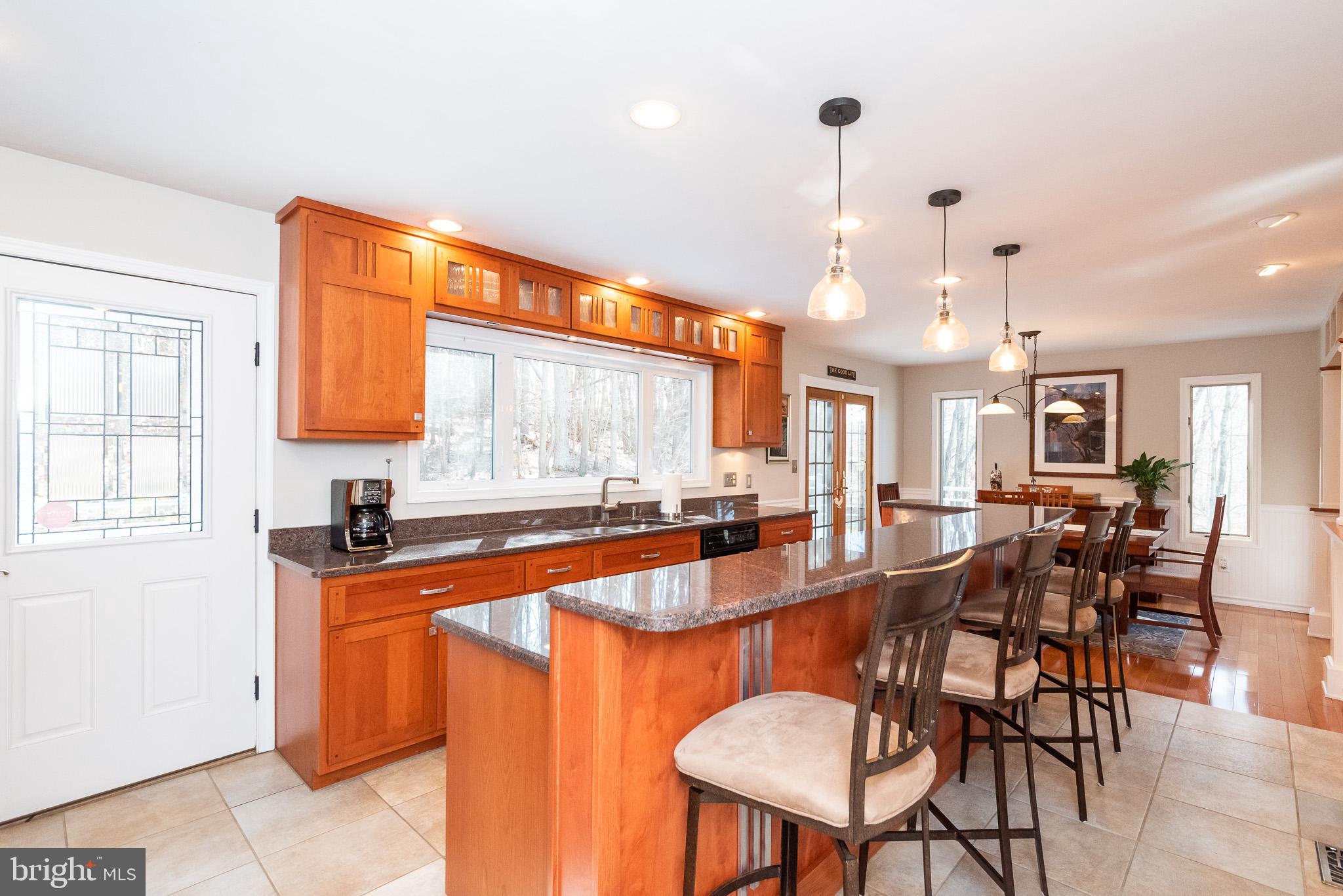 16550 Yeoho Road Sparks, MD 21152 - Photo 19 of 67 a dining hall with stainless steel appliances granite countertop a sink a stove and a refrigerator