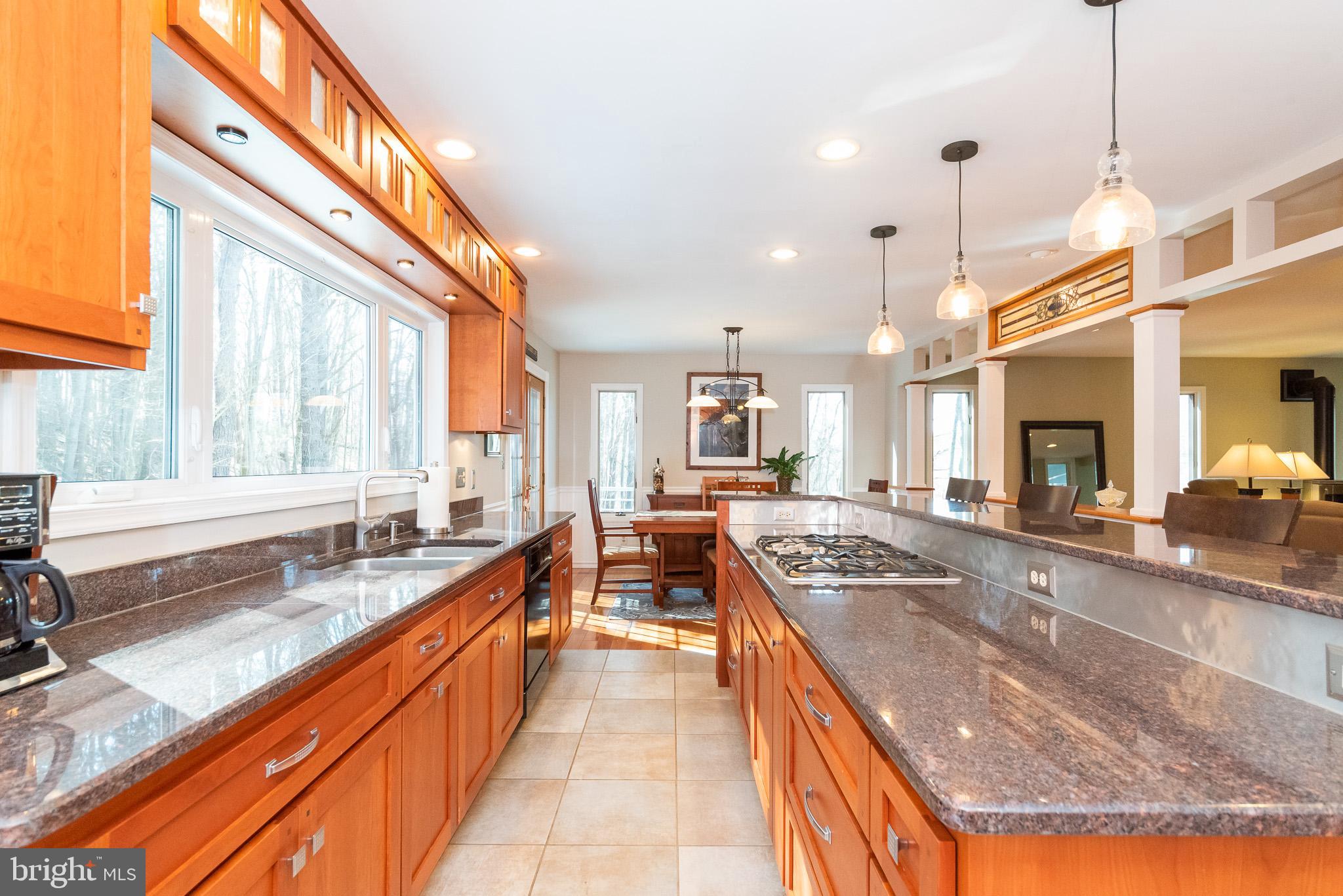 16550 Yeoho Road Sparks, MD 21152 - Photo 20 of 67 a large kitchen with kitchen island a large counter space and a large window