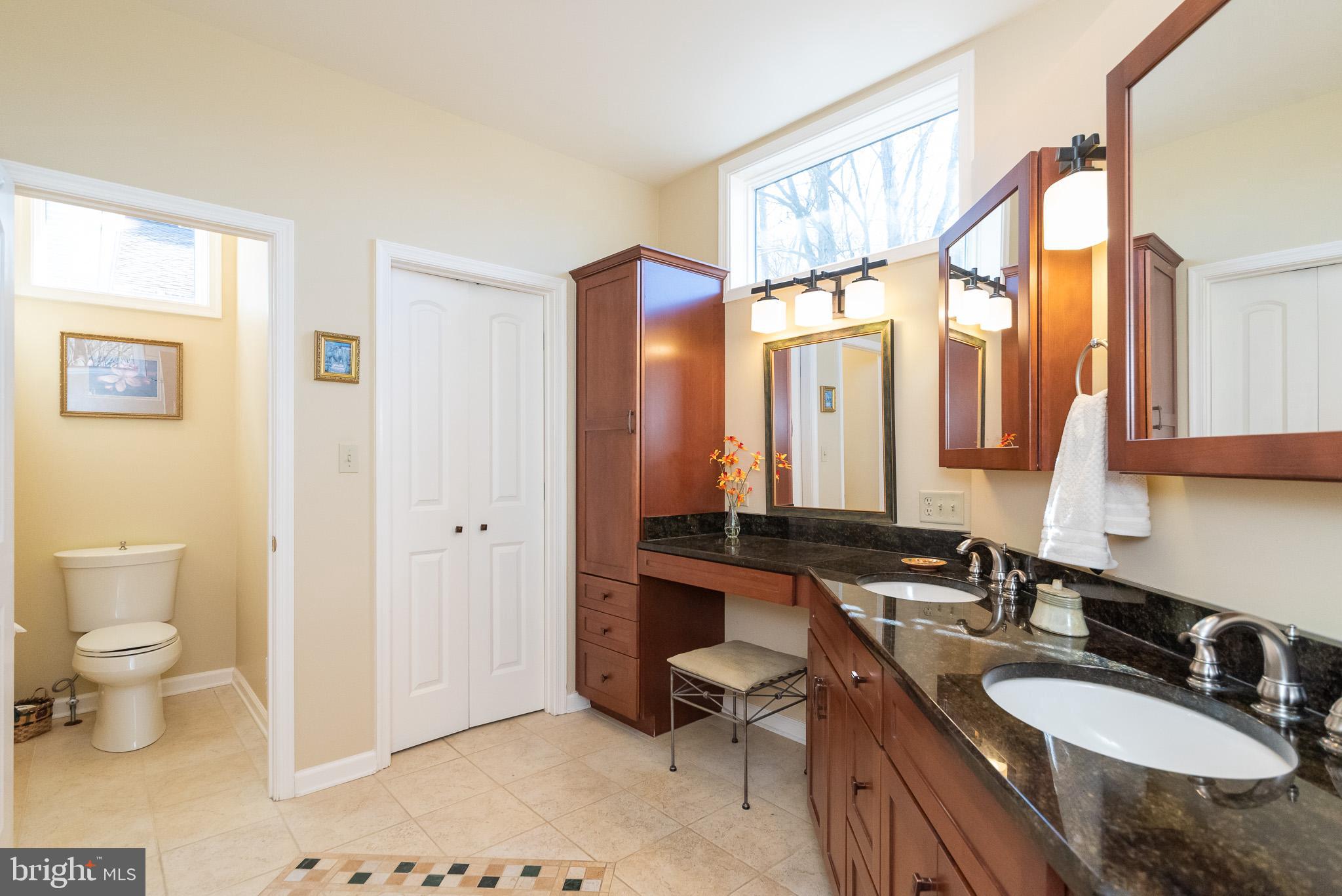 16550 Yeoho Road Sparks, MD 21152 - Photo 36 of 67 a bathroom with a granite countertop sink and a mirror