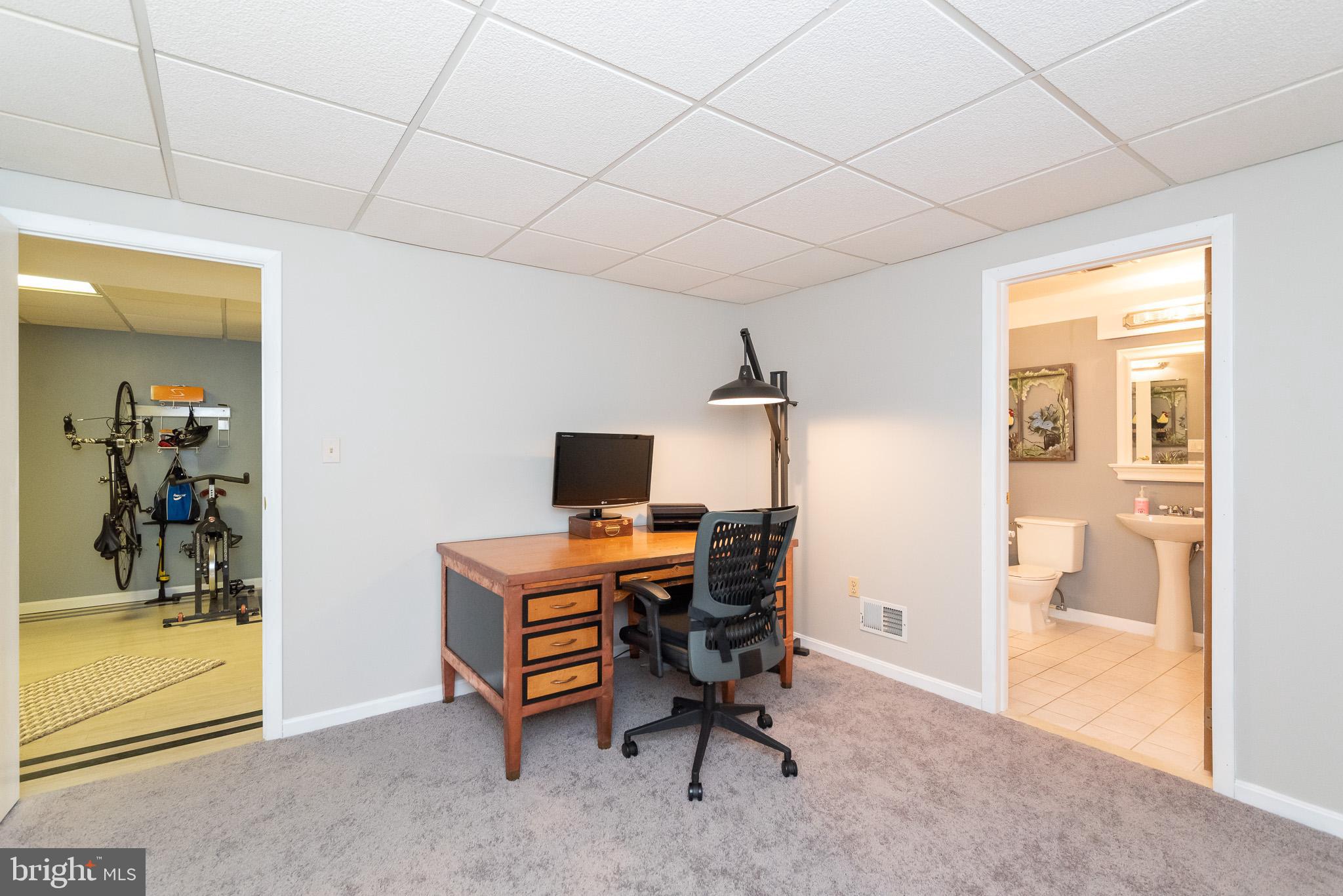 16550 Yeoho Road Sparks, MD 21152 - Photo 46 of 67 a view of a workspace with furniture and a window