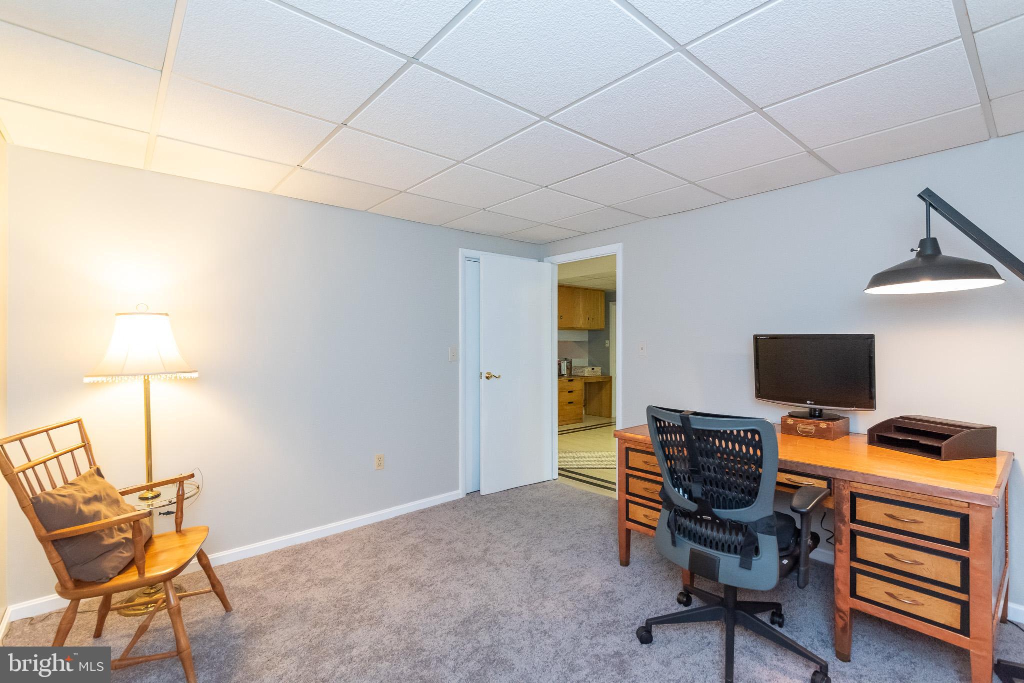 16550 Yeoho Road Sparks, MD 21152 - Photo 48 of 67 a view of a workspace with furniture and a window
