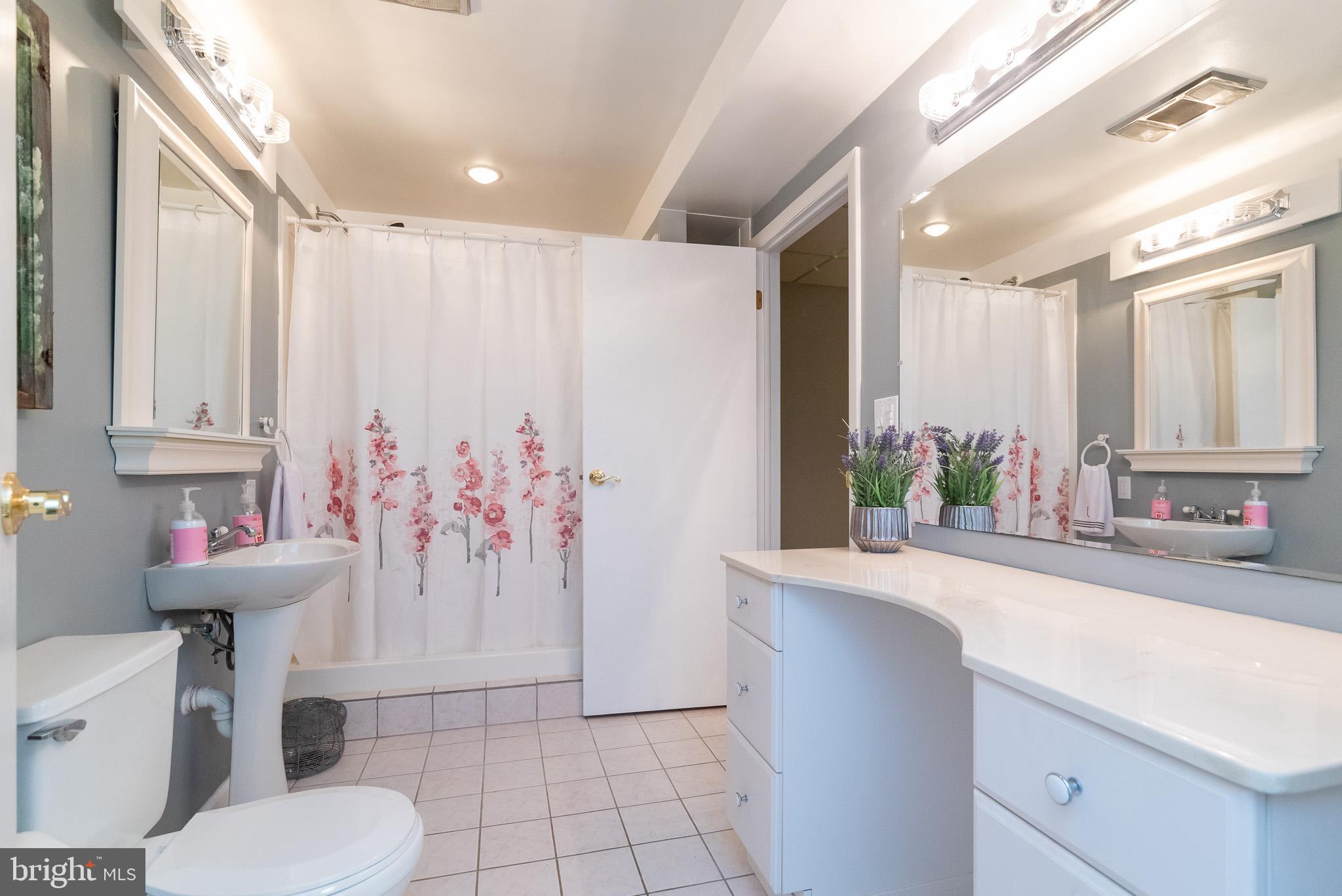 16550 Yeoho Road Sparks, MD 21152 - Photo 50 of 67 a bathroom with a sink toilet and shower