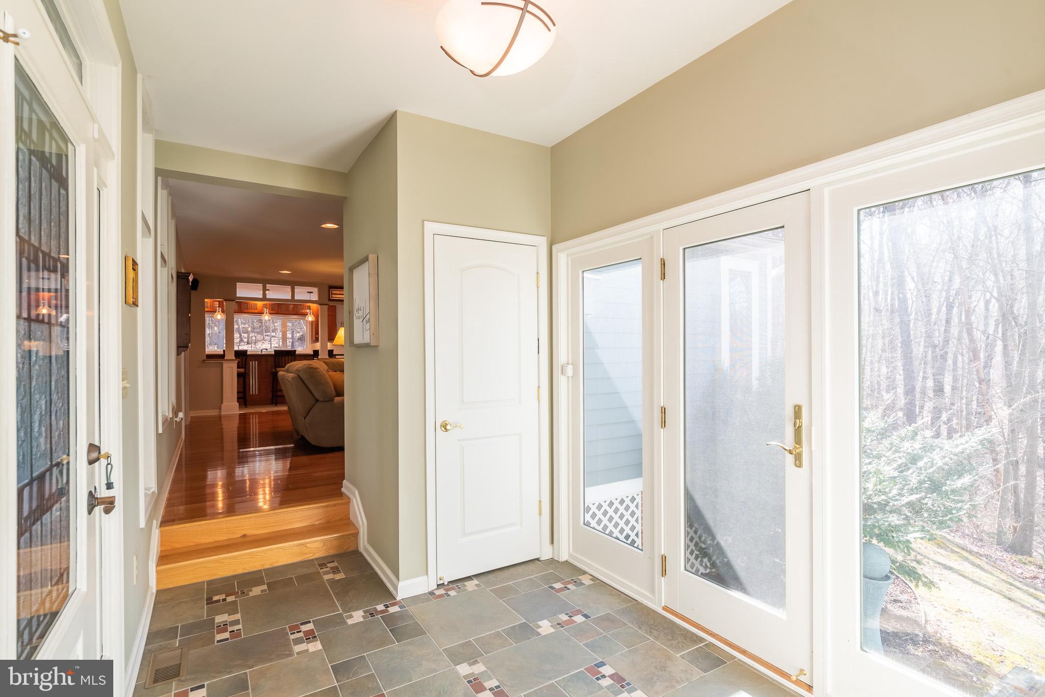 16550 Yeoho Road Sparks, MD 21152 - Photo 6 of 67 a view of a hallway with wooden floor and a living room