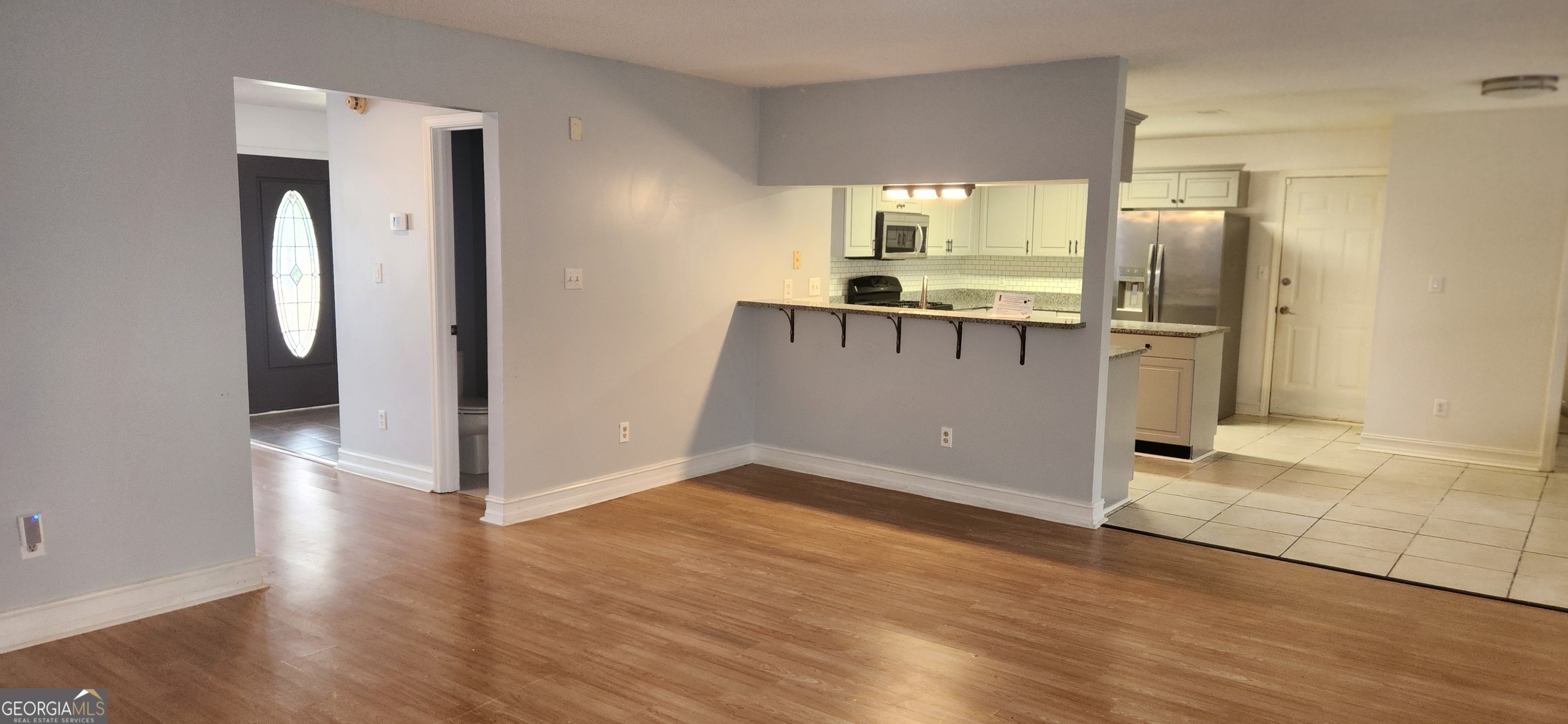 201 Reeves Creek Way Jonesboro, GA 30236 - Photo 4 of 30 Family Room Opens to the Kitchen