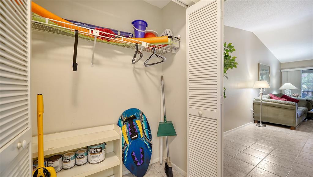 5649 Summerside Lane, Unit 41B Sarasota, FL 34231 - Photo 18 of 41 a bedroom with a bed and a dresser