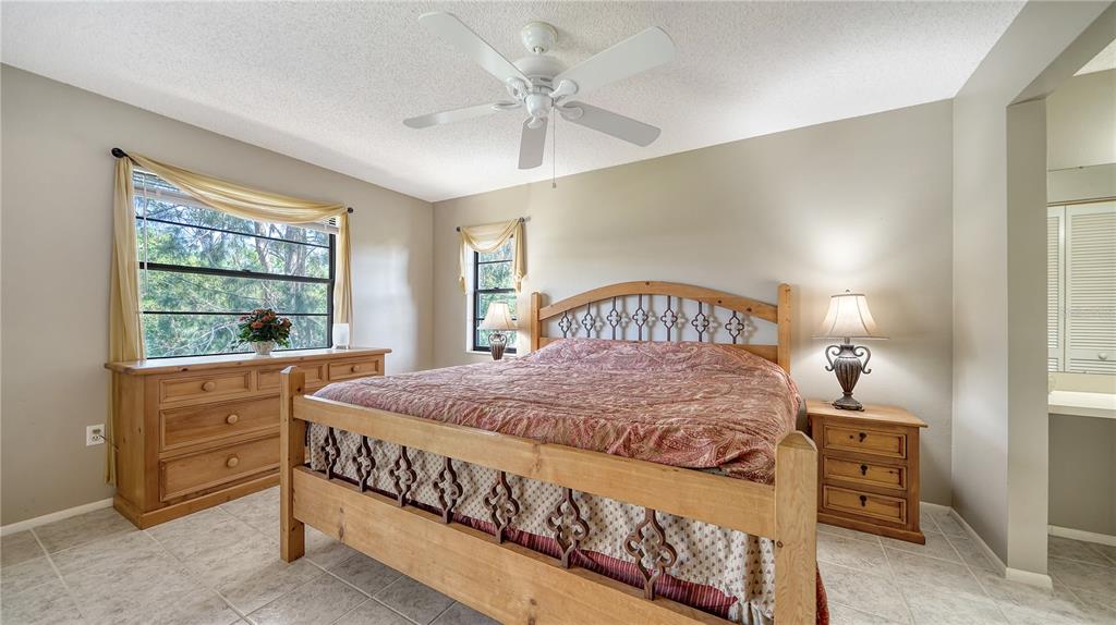 5649 Summerside Lane, Unit 41B Sarasota, FL 34231 - Photo 19 of 41 a bedroom with a bed and a window