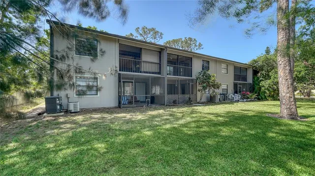 a sign that is sitting in front of flowers