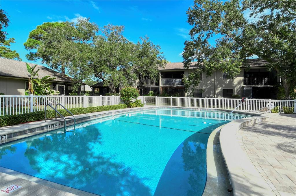 5649 Summerside Lane, Unit 41B Sarasota, FL 34231 - Photo 36 of 41 a view of a house with a backyard