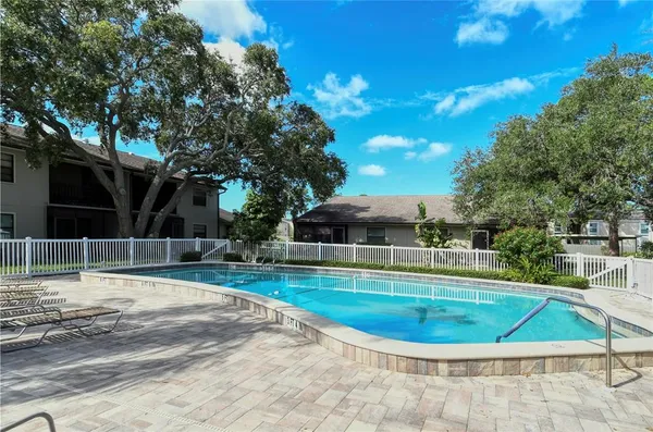 a view of a swimming pool with a patio