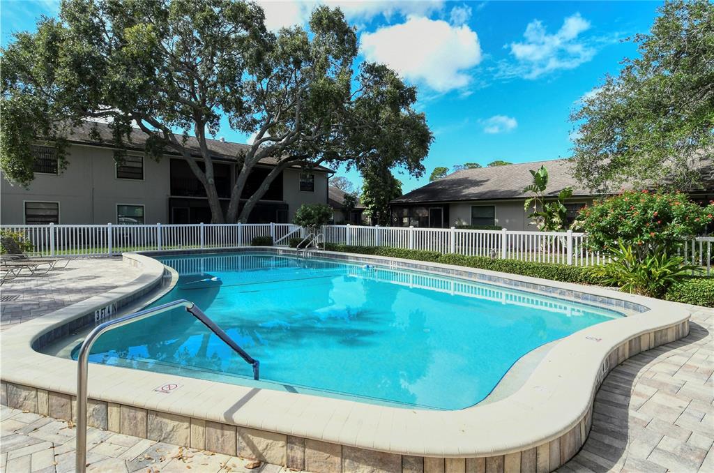 5649 Summerside Lane, Unit 41B Sarasota, FL 34231 - Photo 39 of 41 a view of a swimming pool with a patio
