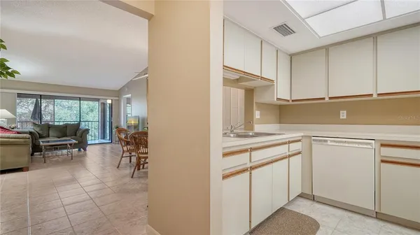 a kitchen with a sink and cabinets