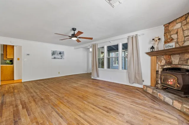 a view of livingroom with hardwood floor and a ceiling fan