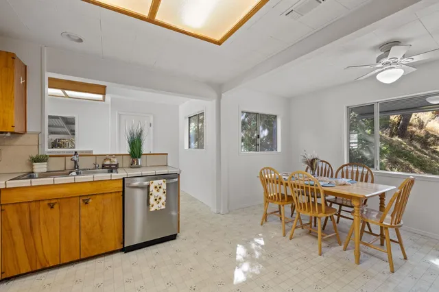 a dining room with furniture and window