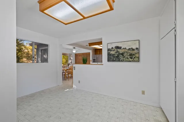a view of a livingroom with wooden floor and furniture
