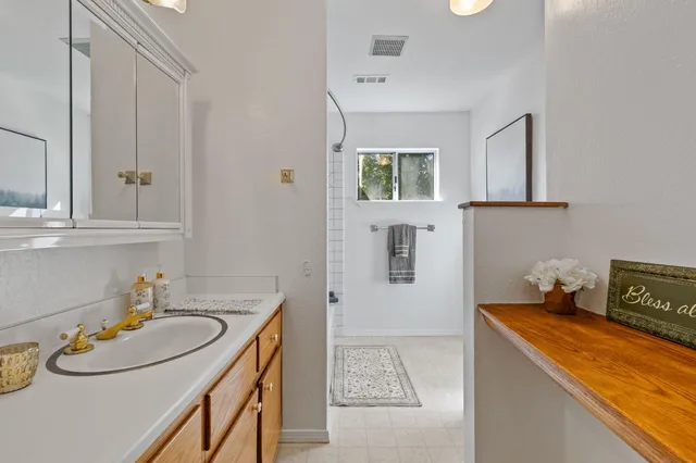 a kitchen that has a sink and a stove