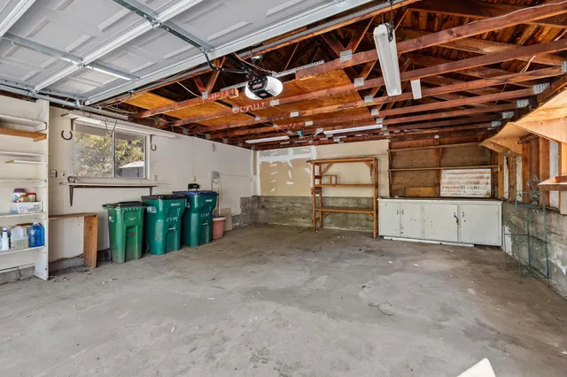 a view of an empty room with wooden ceiling