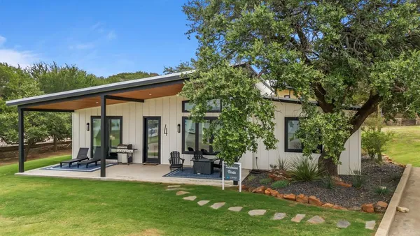 a view of a backyard with a patio