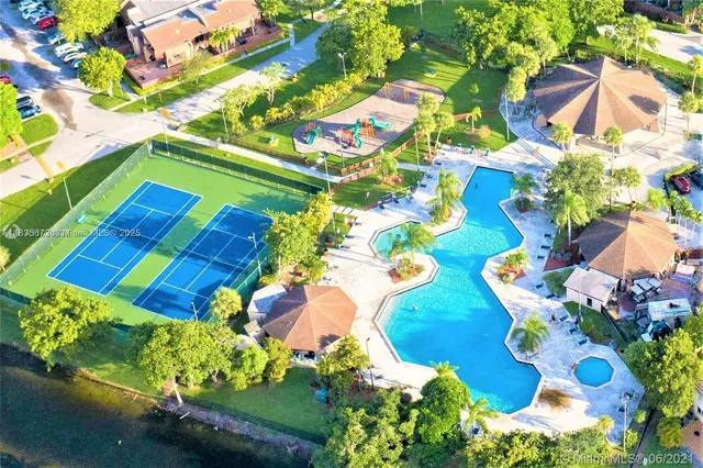 an aerial view of residential house with outdoor space and swimming pool