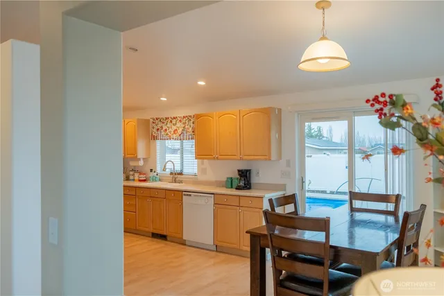 a bedroom with a bed and a lamp