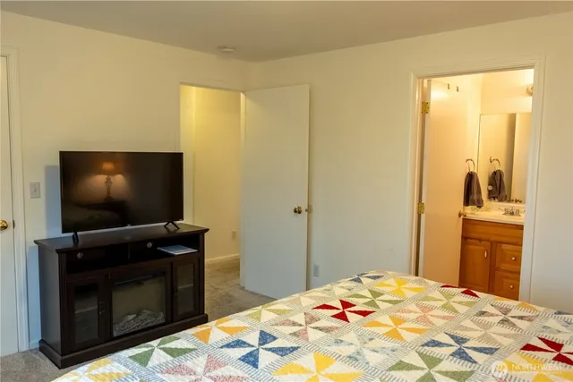 a bathroom with a toilet a sink and shower
