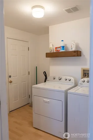 a view of a living room and kitchen