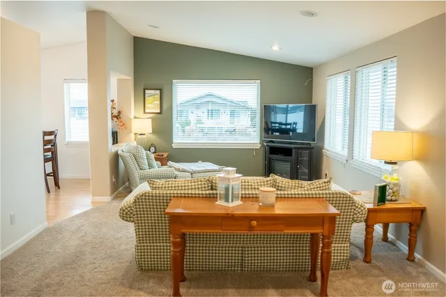 a view of a livingroom with furniture and front door