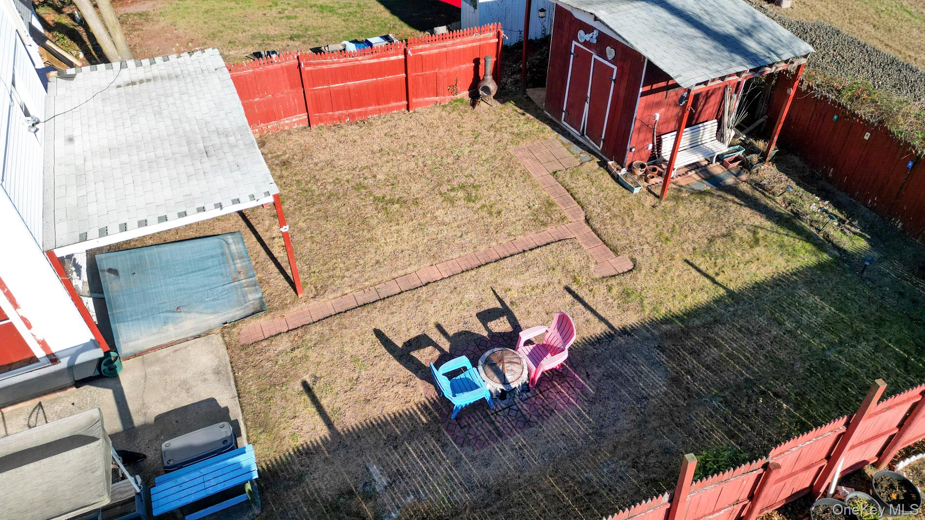 165 Cochran Place Valley Stream, NY 11581 - Photo 19 of 25 Fenced backyard featuring an outbuilding