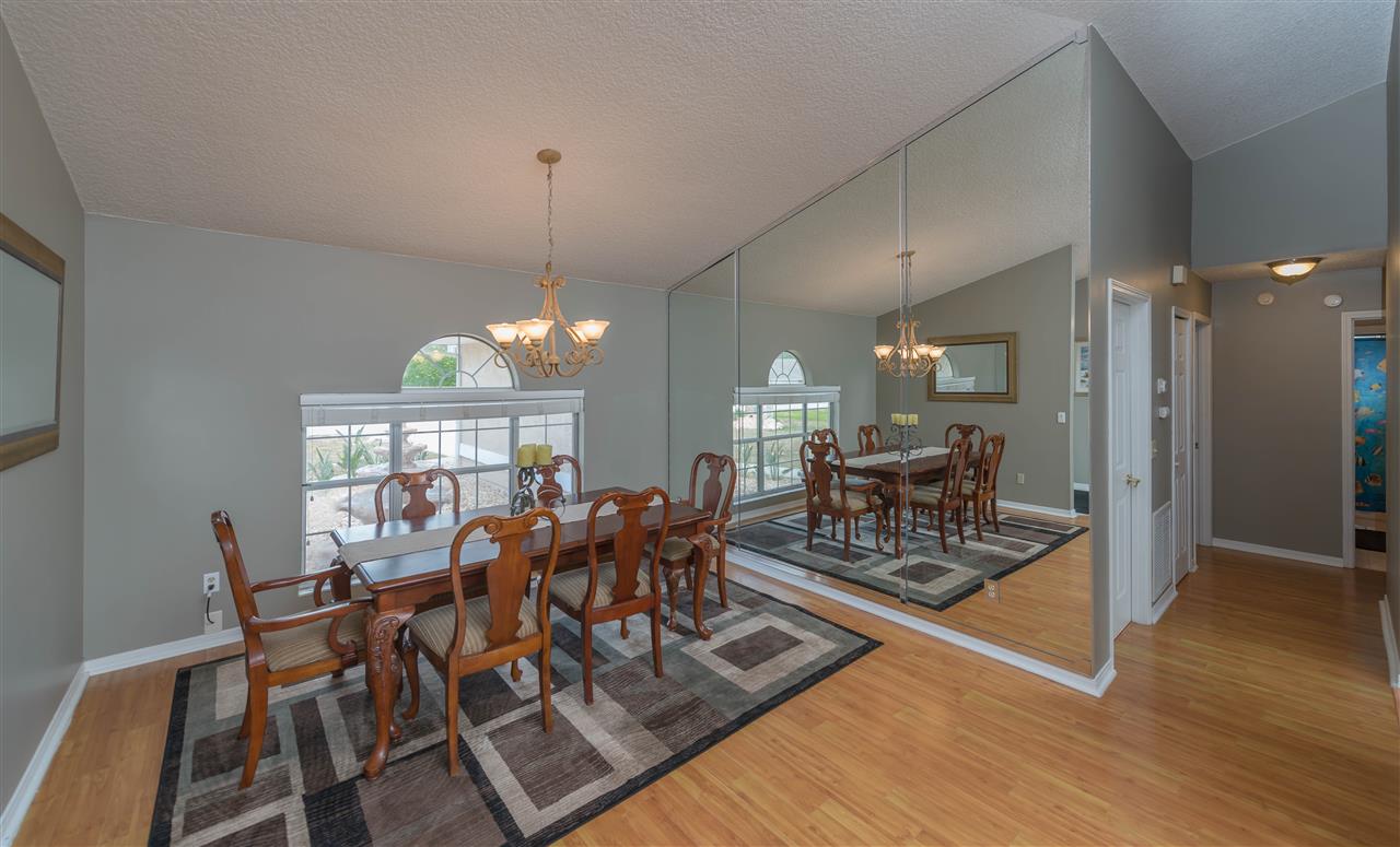 541 Moultrie Wells Road St. Augustine, FL 32086 - Photo 4 of 25 a view of a dining room with furniture window and wooden floor
