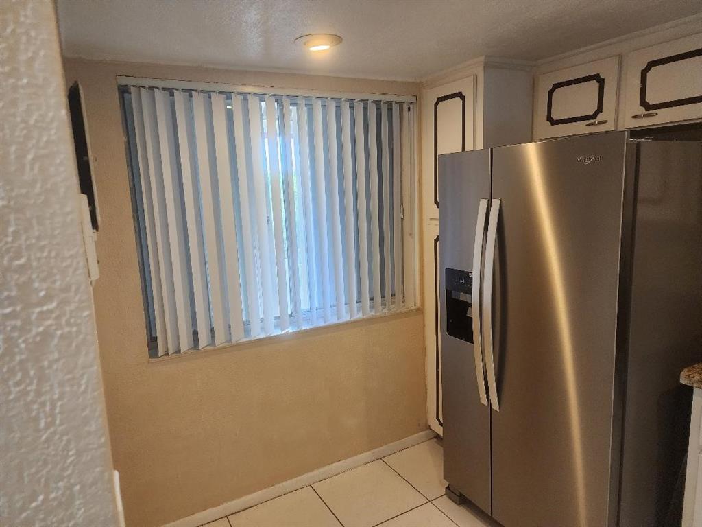 3591 Inverrary Drive, Unit 406 Lauderhill, FL 33319 - Photo 3 of 13 a view of a refrigerator in kitchen