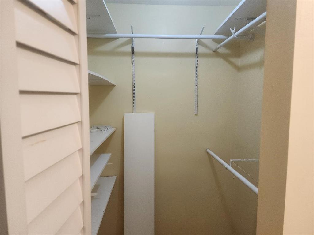 3591 Inverrary Drive, Unit 406 Lauderhill, FL 33319 - Photo 9 of 13 a bathroom with a glass shower door