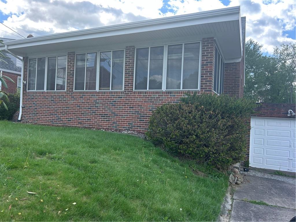 314 Terrace McKeesport, PA 15135 - Photo 2 of 19 a front view of a house with a yard